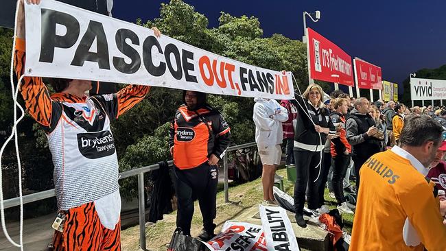 Protest signs at Brookvale last night against Tigers boss Justin Pascoe.