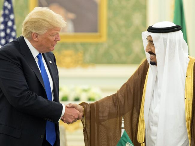 (FILES) This file handout picture provided by the Saudi Royal Palace on May 20, 2017, shows US President Donald Trump (L) and Saudi Arabia's King Salman bin Abdulaziz al-Saud shaking hands during a signing ceremony at the Saudi Royal Court in Riyadh. The war of words between Saudi Arabia and Iran reflects a growing rivalry between the regional heavyweights, but experts believe the risk of a direct military clash between them is low. / AFP PHOTO / Saudi Royal Palace / BANDAR AL-JALOUD / RESTRICTED TO EDITORIAL USE - MANDATORY CREDIT 