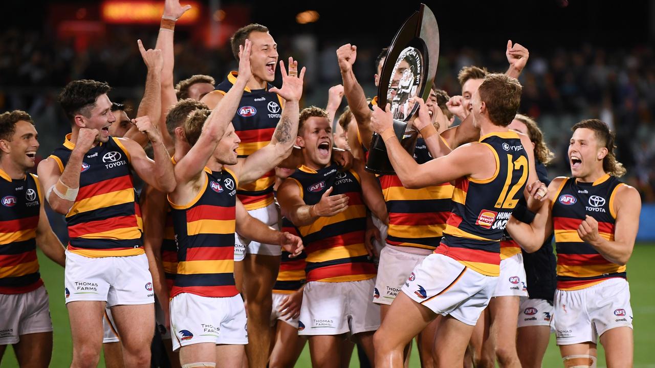 Jordan Dawson of the Crows brings the Variety Showdown Shield to the team. Picture: Mark Brake