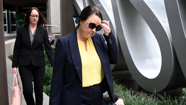 Kylie Rika (right), a senior scientist at FSS, leaves after giving evidence to the commission of inquiry into forensic DNA testing at the Magistrates Court in Brisbane. Picture: NCA NewsWire / Dan Peled