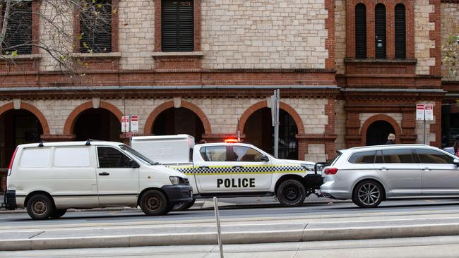 Police on North Tce outside Parliament House, which is considered at the centre of rising anti-social behaviour in the CBD. Picture: Brett Hartwig