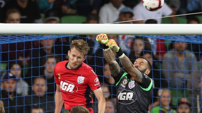 Paul Izzo clears a ball over Ben Halloran’s head while keeping a clean sheet on Saturday. Picture: AAP Image/David Crosling