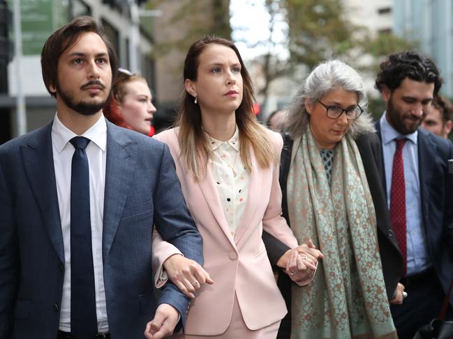 Hannah Quinn (centre, pink suit) arrives at the NSW Supreme Court with her family and supporters. Picture: NCA NewsWire / Christian Gilles