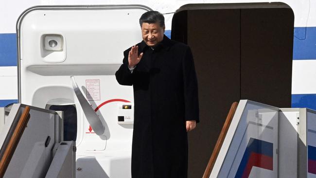 China's President Xi Jinping waves as he disembarks his aircraft upon arrival at Moscow's Vnukovo airport. Picture: AFP