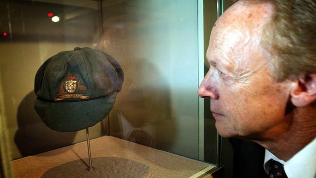 Sir Donald Bradman’s son, John, with the baggy green cap his father wore in his 1928 Test debut.