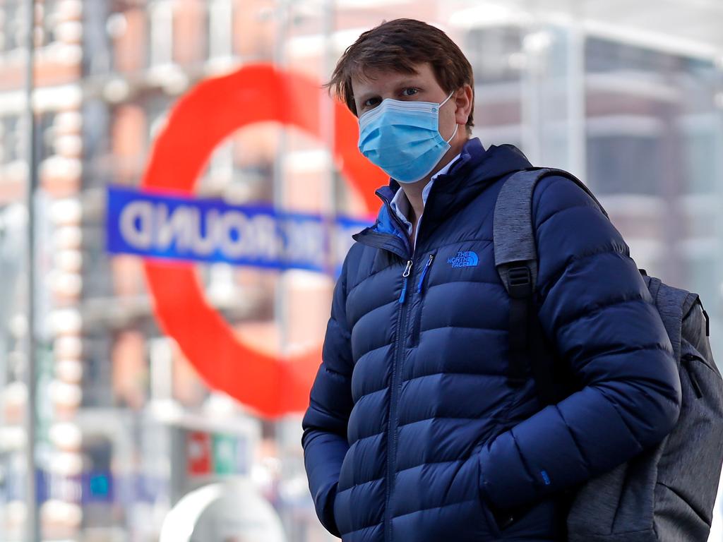 A commuter wearing PPE in London heads back onto the tube. Picture: Tolga Akmen / AFP.