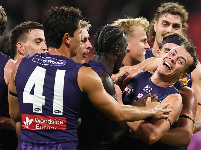 SYDNEY, AUSTRALIA - MAY 17: Cooper Simpson of the Dockers celebrates kicking a goal with team mates during the round ten AFL match between GWS Giants v Walyalup (Fremantle Dockers) at ENGIE Stadium, on May 17, 2025, in Sydney, Australia. (Photo by Cameron Spencer/AFL Photos/Getty Images)