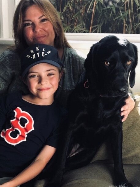 Rebekah Elmaloglou at home with her son and dog.