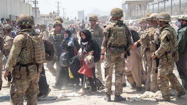 Members of the British and US Armed Forces working at Kabul Airport. President Biden’s conduct of the withdrawal from Afghanistan will be remembered as a defining stupidity of our time—one of many. Picture: AFP