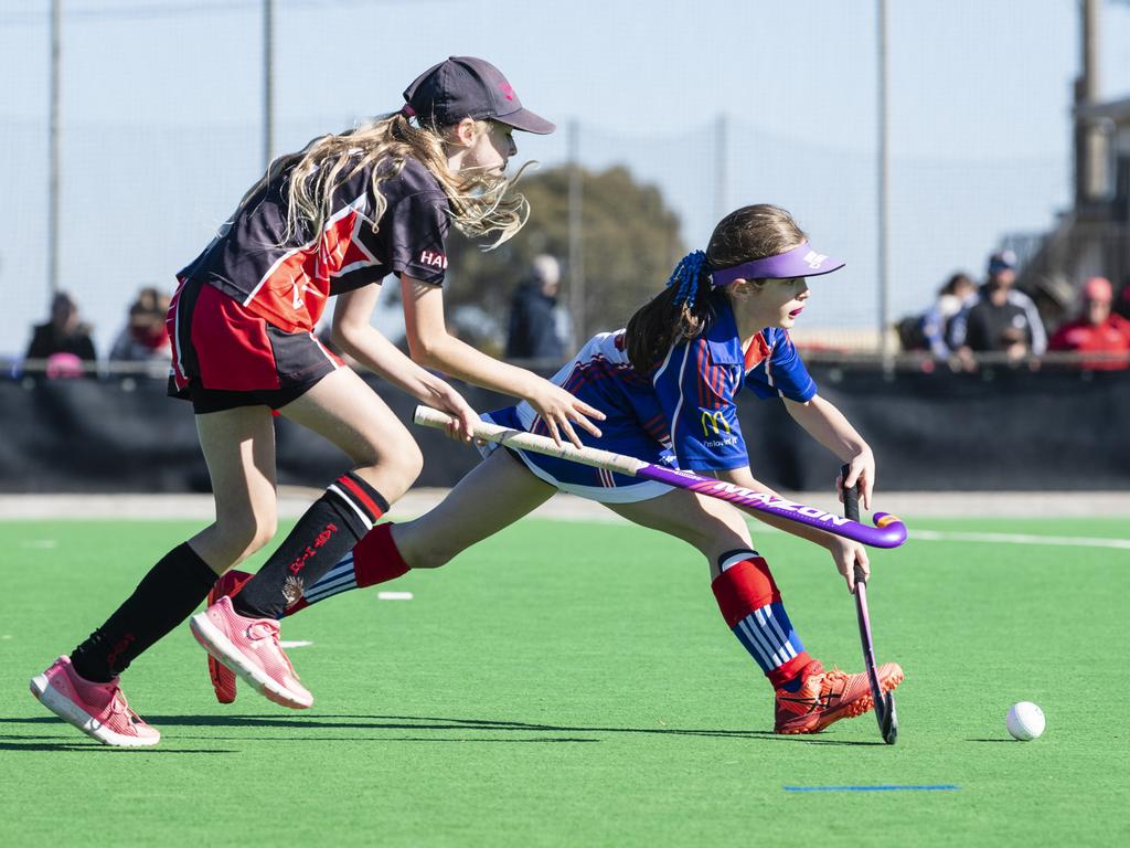 Mackenzie Marks (left) of Past High and Isla Fea of Rangeville in under-11 girls Presidents Cup hockey at Clyde Park, Saturday, May 27, 2023. Picture: Kevin Farmer