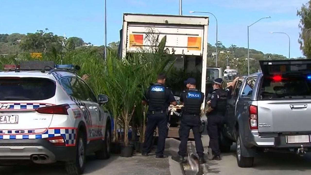 Police officers at a truck stopped in Elanora on the Gold Coast about 12.45pm on Friday. Picture: Nine Gold Coast News