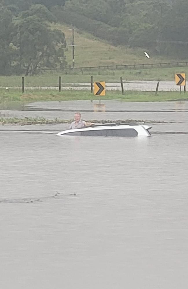 A North Coast man was rescued from the roof of his car in rising floodwaters by Keith Graham on Boatharbour Road out of Lismore on Friday. Picture: Keith Graham