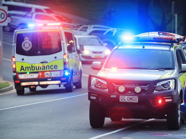 March 13, Rainbow Bay, Coolangatta, Gold Coast - Queensland Ambulance Officers interview witnesses to a mistaken report of a shark attack which turned out to be a self inflicted Surfing Fin Chop.Picture Scott Powick Newscorp