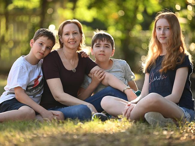 17/09/2021 : Breast cancer sufferer Susan Reilly, 47, mother of three, Charlotte 14, Liam (L in white shirt) and Jacob  both 11, at a park near their home in Forrest Lake, Brisbane. Susan  nursed her own mother with fatal breast cancer, now has the bitter sweet prospect of the new VAD laws passed in QLD being a  possible factor for her into the future . Lyndon Mechielsen/The Australian