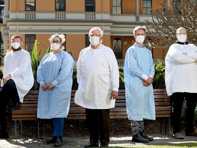 WEEKEND TELEGRAPHS SPECIAL - SPEAK TO PICTURE EDITOR JEFF DARMANIN BEFORE USE - Covids hidden heroes. Pathologists at St Vincent's Hospital in Darlinghurst who are on the front line in analysing the Covid tests each day. L-R David Lorenz (senior hospital scientist), Hibah Harakeh (specimen reception), Jock Harkness (micro biologist), Michael Alexander (specimen reception manager) and Damien Stark (principal head scientist). Picture: Toby Zerna