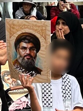 A child carrying an image of Hezbollah leader Hassan Nasrallah (pictured). Picture: Supplied