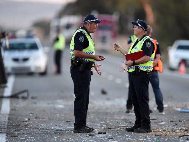 Police at the scene of the horrific head-on smash between a car and truck on the Augusta Highway at Crystal Brook. Two children and their grandparents died. Picture: Tom Huntley