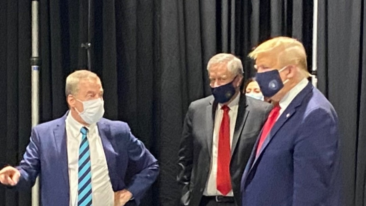 Trump pictured wearing a mask in May.