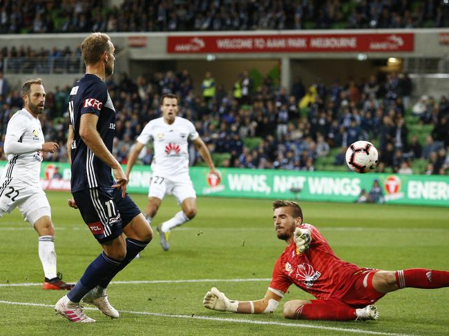 Ola Toivonen kicks the ball past Wellington Phoenix goalkeeper Filip Kurto. 