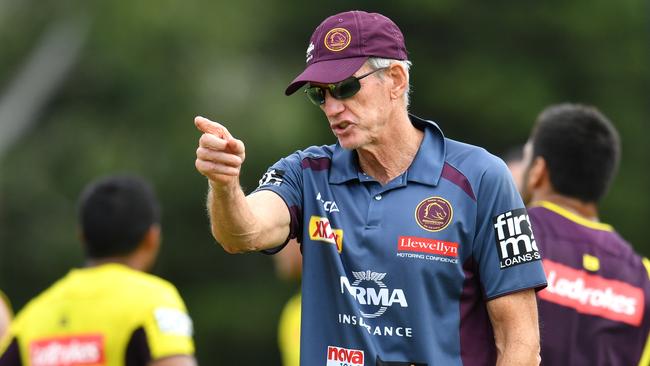 Jack Bird (left) is seen talking to Brisbane Coach Wayne Bennett (right) during Brisbane Broncos training at Clive Berghofer Field in Brisbane, Thursday, March 22, 2018. The Broncos are playing their third round NRL match against Wets Tigers on Friday night in Sydney. (AAP Image/Darren England) NO ARCHIVING, EDITORIAL USE ONLY