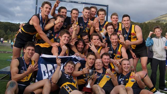 Woori Yallock strikes a premiership pose after completing a hat-trick of flags in 2014. Picture: Robyn Kuys