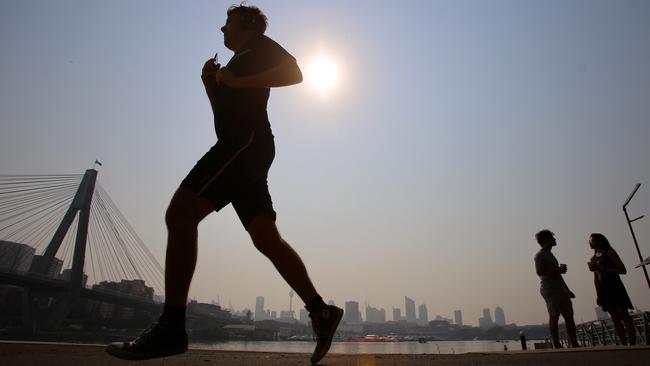 A jogger in Sydney’s Blackwattle Bay. Picture: AAP