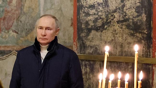 Russian President Vladimir Putin attends an Orthodox Christmas mass in the Cathedral of the Annunciation at the Kremlin in Moscow.