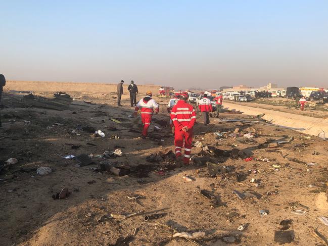 Debris is seen from the plane crash on the outskirts of Tehran. Picture: AP