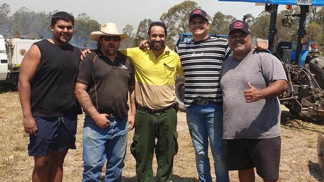 Latrell Mitchell (second right) has been helping out with the bushfires in Taree.