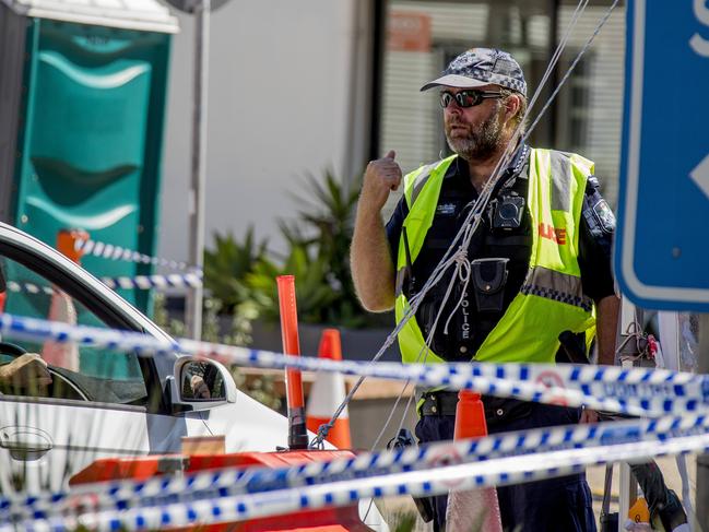 The Queensland Premier has announced changes to the  border restrictions and says that no more police will be needed to patrol the state's borders with New South Wales. Police at the Griffith St, Coolangatta, border site . Picture: Jerad Williams