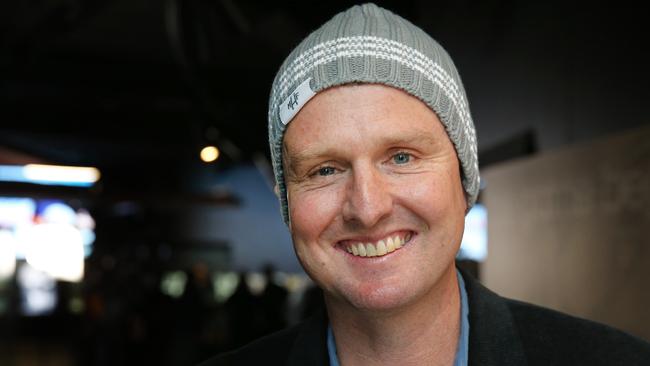 Mark Hughes in one of his beanies for brain cancer. Picture: Richard Dobson.