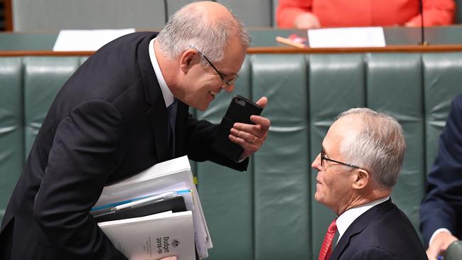 Prime Minister Malcolm Turnbull, right, speaks with Treasurer Scott Morrison. Picture: AAP.