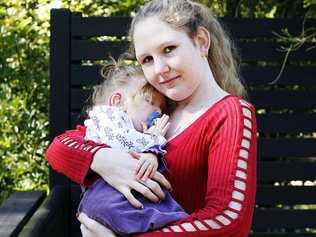 Christine Priestley holds her 22-month-old daughter, Adele Elliott, who suffers from a rare genetic condition. Picture: Claudia Baxter