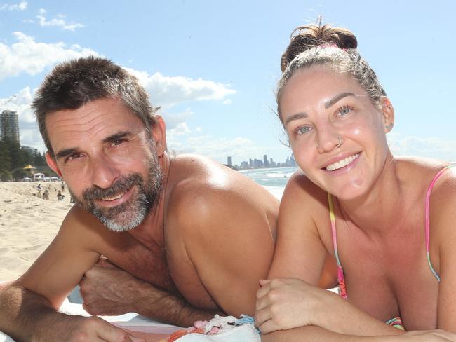 Pictured At Burleigh Heads Beach enjoying the last warm beach weather before the cool snap next week. L-R Dave Frank and Jacqui Jones Ph 0413995439.Pic Mike Batterham