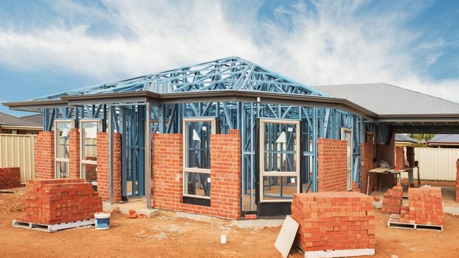 New residential construction home from brick with metal framing against a blue sky; real estate Australian generic suburban homes