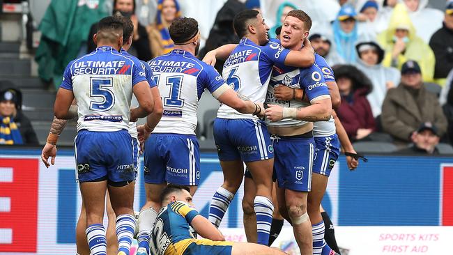 Dylan Napa of the Bulldogs celebrates scoring a try (Photo by Mark Metcalfe/Getty Images)