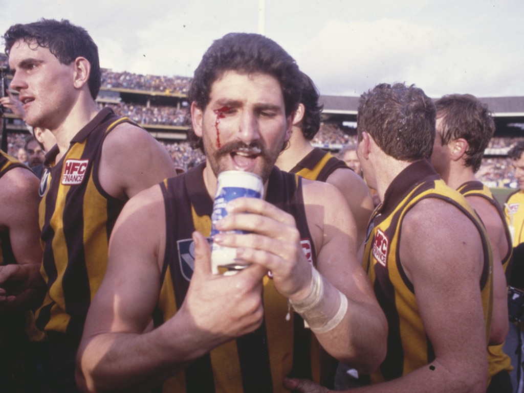 A hard earned thirst for 'The Dipper' after the 1986 premiership. Picture: Rennie Ellis, courtesy State Library Victoria