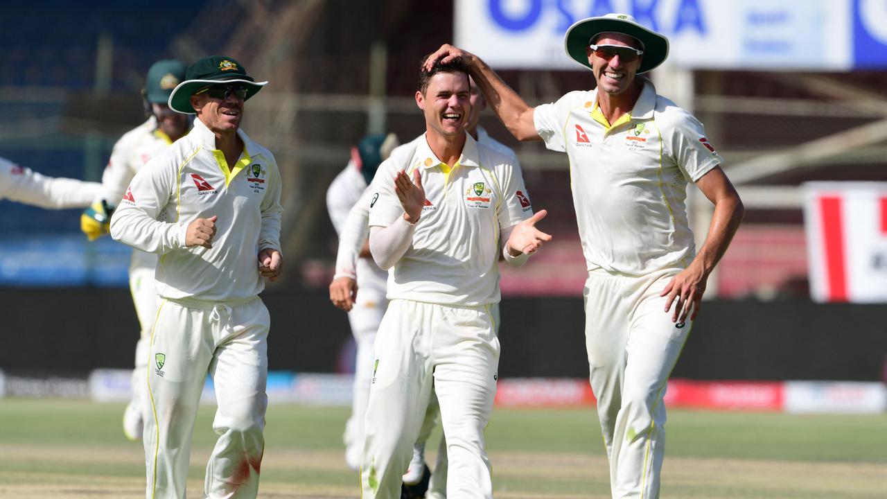 Australia's Mitchell Swepson celebrates with his teammates after the dismissal of Pakistan captain Babar Azam. Photo by ASIF HASSAN / AFP