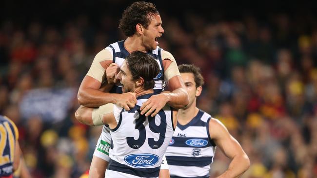 Steven Motlop celebrates a goal with Shane Kersten.