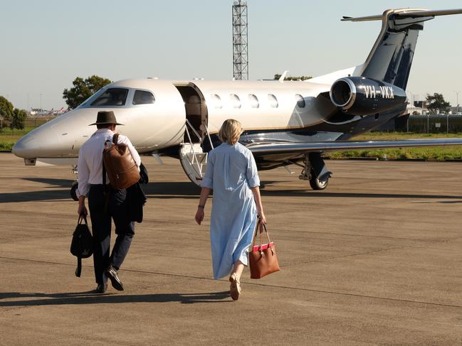 Steven Miles and Shannon Fentiman prepare to board a private jet leased for a whirlwind tour of Queensland. Picture: Liam Kidston