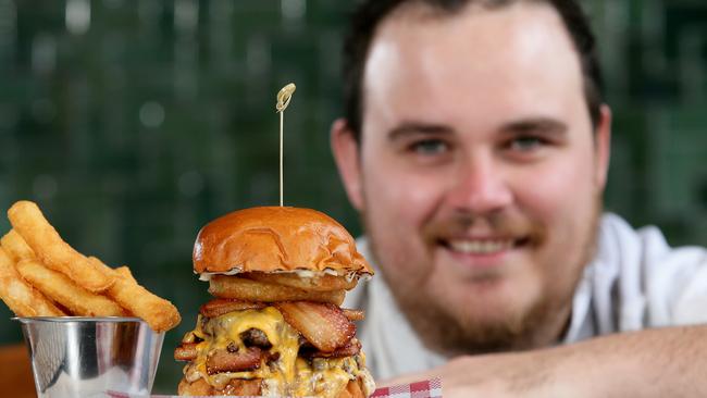 Dee Why Hotel chef Brad Johnston with his Trufflenator burger. Picture: Troy Snook