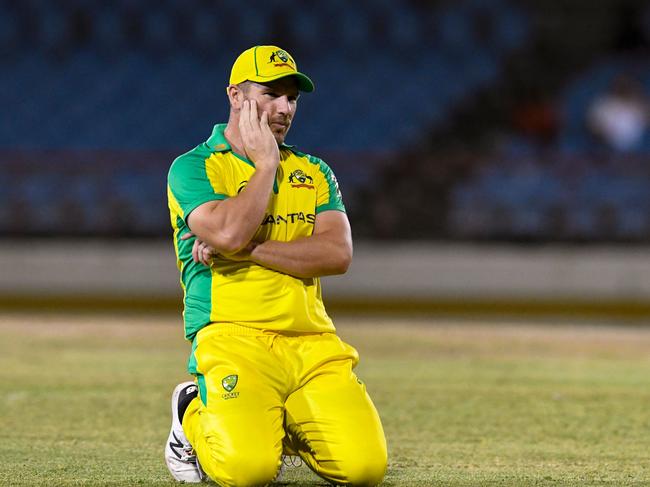 Aaron Finch of Australia express disappointment as the ball goes to the boundary during the 3rd T20I between Australia and West Indies at Darren Sammy Cricket Ground, Gros Islet, Saint Lucia, on July 12, 2021. (Photo by Randy Brooks / AFP)