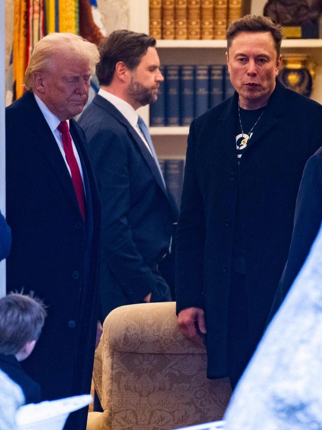 US Vice President JD Vance exits the Oval Office in the opposite direction as US President Donald Trump and Elon Musk. Picture: AFP