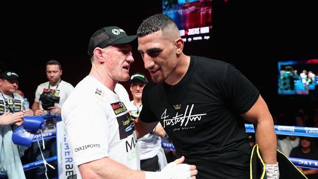 SYDNEY, AUSTRALIA - JUNE 16: Justis Huni is congratulated by Paul Gallen after winning their Australian heavyweight title fight at ICC Sydney on June 16, 2021 in Sydney, Australia. (Photo by Cameron Spencer/Getty Images)