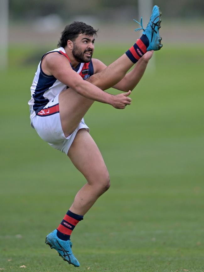 EDFL: St Albans’ Andre Srour kicks for goal. Picture: Andy Brownbill