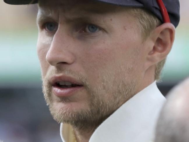 England's Joe Root, right, talks after their Ashes cricket test match loss to Australia in Perth, Australia, Monday, Dec. 18, 2017. Australia won by an innings and 41 runs. (AP Photo/Trevor Collens)