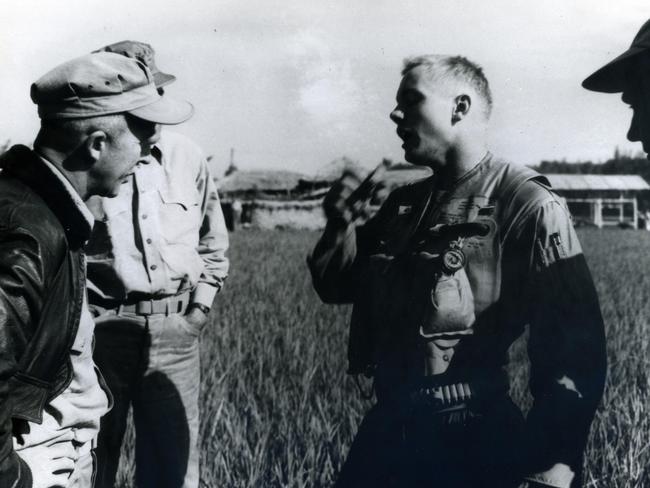 Navy pilot Neil Armstrong (right) after his Grumman F9F-2 Panther was shot down in Korea in 1951.