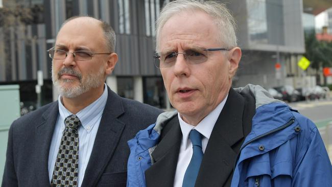 Dr Jim Buckley (right) from the Royal Adelaide Hospital, after giving evidence at the inquest into the deaths of stroke victims Michael John Russell and Leslie Robert Graham at the Coroner's Court. Picture: AAP/David Mariuz