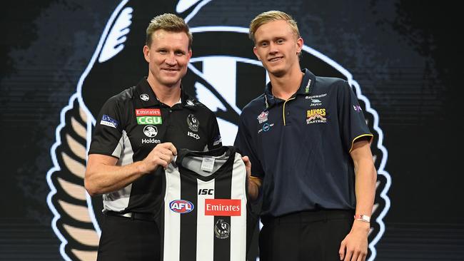 Magpies head coach Nathan Buckley with Jaidyn Stephenson during the 2017 AFL Draft.