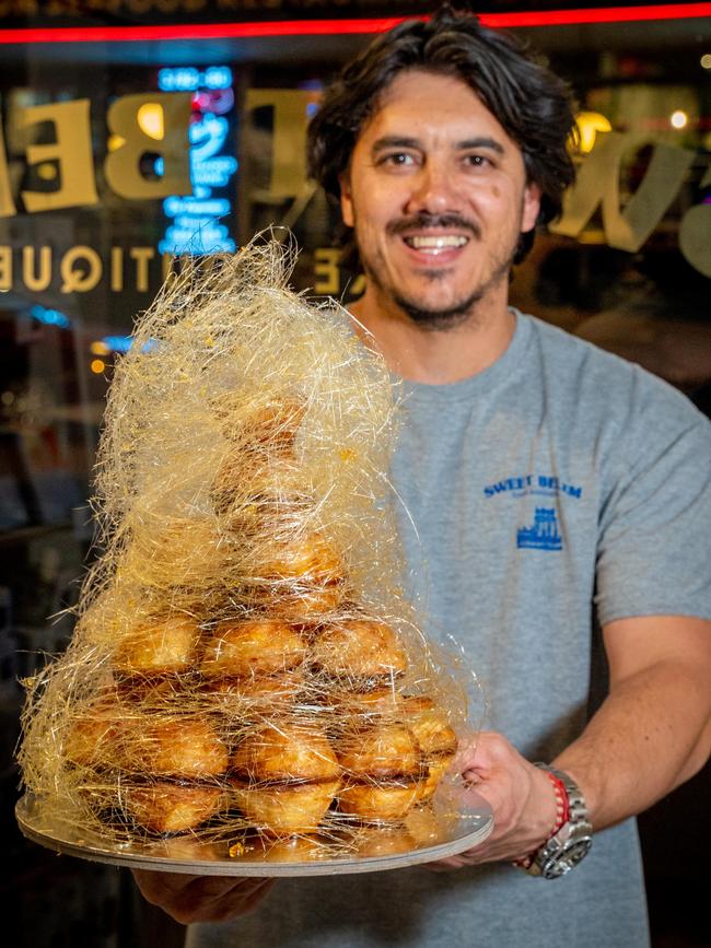 Sweet Belem’s co-owner Jose Silva with a tart tower. Picture: Social Media Soup